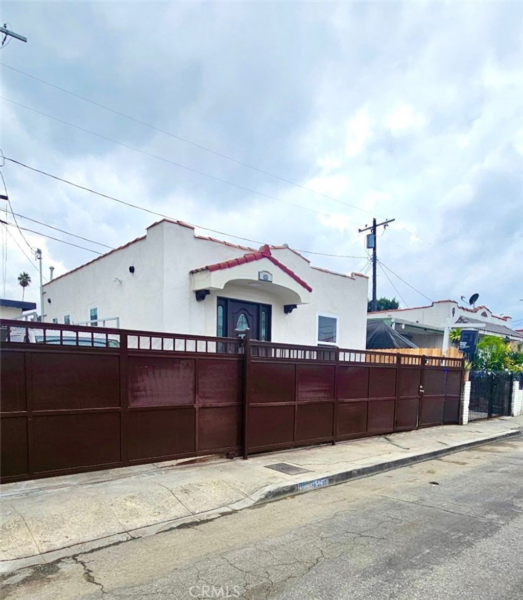 Photo of 426 W 63rd Pl, Los Angeles, CA 90003 (MLS # DW25269766)