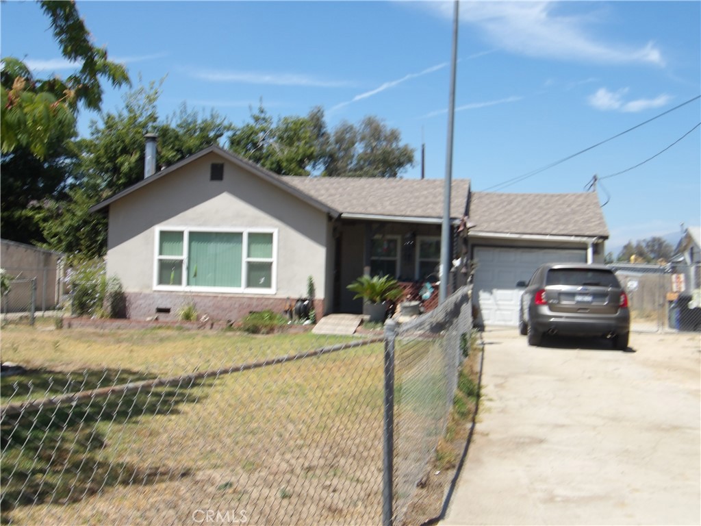 Almost half acre, all level and usable. Has a one car, attached garage and a 720 square foot, two car, detached garage / shop with 220 power. Updated kitchen with hard surface counters. New tankless water heater, new attic insulation. Dual paned windows, ceiling fans, wood burning stove, 14x24 enclosed patio, covered front porch. Lots of room for a garden, animals, maybe even horses, check with the county. Even has a a "Big Red Barn" with a hay loft. First time on the market in over 40 years. Owner is downsizing and moving out of the area.