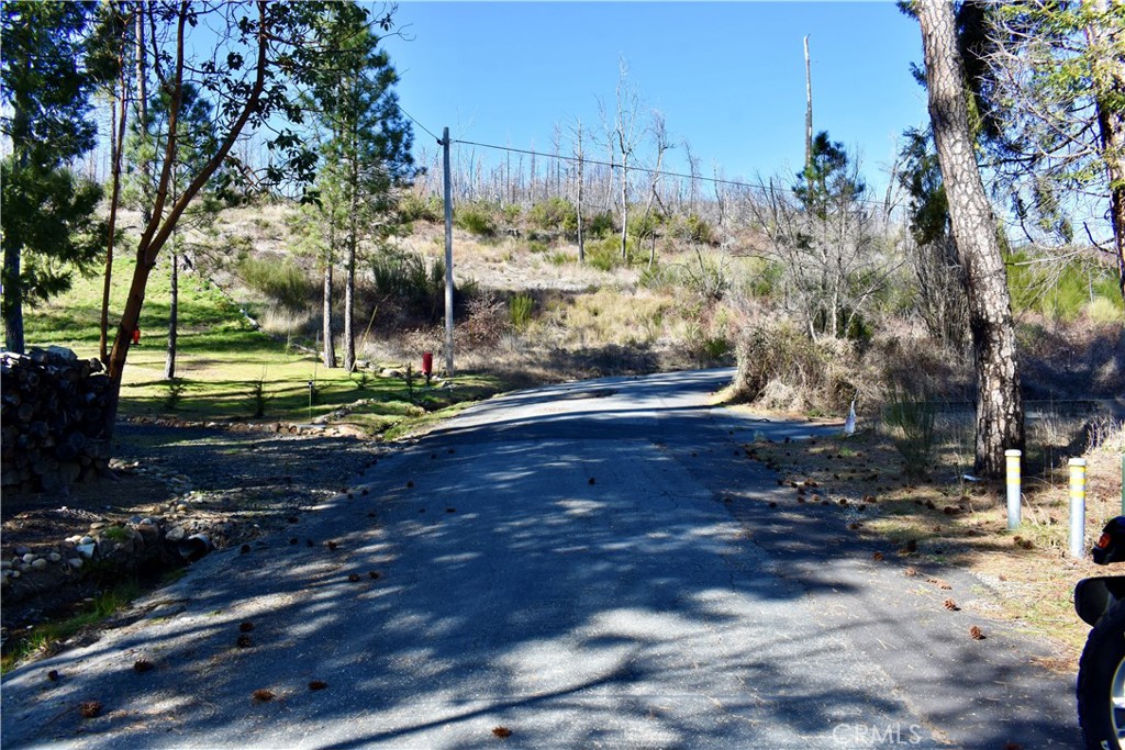 Lake Madrone – Oversized Lot in a Gated Mountain Community
Discover a rare opportunity to own a sprawling 0.68-acre lot at Lake Madrone, created by merging three individual parcels into one expansive homesite. With power, water, and septic already in place, this property is primed for your dream home or cabin in a breathtaking mountain setting.
Tucked away in Butte County’s hidden gem, this gated lakeside community offers a serene retreat in the heart of the Shasta Cascade region. Enjoy paved roads winding through towering redwoods, dogwoods, and pines at a comfortable 2,000 ft elevation, providing a picturesque year-round escape.
Perfectly situated across from the caretaker’s cabin and backing up to a peaceful meadow, this lot offers both privacy and convenience. As a Lake Madrone property owner, you’ll enjoy exclusive access to a private 25-acre lake, a beach along the east shore, lakeside picnic and BBQ areas, a basketball court, and scenic lounge areas—perfect for relaxing or entertaining.
Whether you envision a weekend getaway, seasonal retreat, or full-time living, this oversized lot offers endless potential in one of Northern California’s most charming lake communities. Don’t miss this rare chance to build your mountain retreat—schedule a visit today!