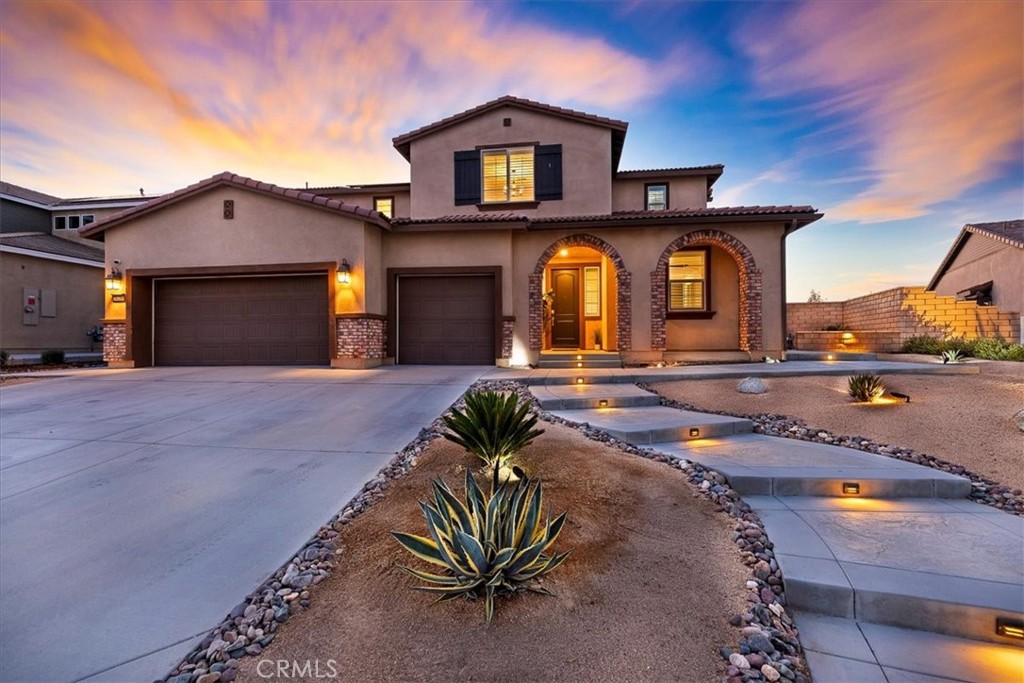 Step into a one of a kind retreat that redefines the meaning of a dream home. This beautifully upgraded 6-bedroom, 4.5-bathroom Next Gen property is a rare find, designed to impress at every turn. This spacious residence includes a fully equipped attached private suite (ADU) with its own private entrance, patio, kitchenette, living area, bedroom, retreat, bathroom and laundry room. It is ideal for multi-generational living, guests, or potential rental income.
The front yard features drought tolerant plants on a drip system for ease, and landscaping complemented by thoughtfully designed concrete elements that add sophistication and curb appeal.
Step into an open-concept layout illuminated with natural light, high-end finishes, and thoughtful upgrades throughout. The gourmet kitchen showcases sleek quartz countertops, double ovens, premium stainless-steel appliances, and a generously sized center piece island perfect for gathering and entertaining.
Head upstairs and relax in your loft and 5 additional bedrooms. The primary suite offers a spa inspired bathroom with dual sinks, vanity, separate soaking tub, walk in shower and spacious walk in closet filled with natural light from its own window. Another jr suite down the hall offers its own en-suite bath. The remaining bedrooms are thoughtfully served by an oversized stylish bathroom. Located upstairs for convenience, the laundry room features a premium washer and dryer with abundant storage and shelving.
Escape to your own private resort in the comfort of your backyard. Unwind and enjoy sunny California days in the newer (2023) custom, heated, salt water, Pebble Tec pool and spa, complete with a built-in fire pit, an outdoor cooking area including a refrigerator, and built in, brand new, never used Bull Lonestar grill. Relax under your expansive vinyl patio cover, offering shade and comfort year round, all framed by durable vinyl fencing. Designed with sustainability in mind, the yard includes artificial turf for effortless maintenance. With over $200,000 in upgrades, no detail has been overlooked.
Additional features include: Solar, energy-efficient systems, new modern LVP flooring throughout, 3-car garage, Smart home technology, tankless water heater, garage wired for 220 volt EV charger, dual HVAC units, rain gutters, and a fire suppression system including sprinklers.
This isn’t just a home, it’s a lifestyle masterpiece that exceeds expectations and sets a new standard for Menifee living.
