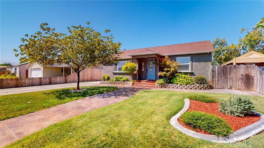 Welcome Home! This beautifully updated 3-bedroom, 2-bathroom home (just under 1,600 sq. ft.) has it all- owned solar, RV parking, a spacious garage/shop with alley access &  more RV parking along with timeless upgrades throughout. From the moment you arrive, stamped concrete, mow strips, and pristine landscaping create an inviting first impression. Inside, the cozy living room features a wood stove insert and built-in shelving, while natural light streams through newer dual-pane windows, illuminating the newer laminate flooring. The open floor plan flows seamlessly into the dining and kitchen areas, where you’ll find soft-close cabinetry, Corian countertops, new appliances, and a walk-in pantry with an updated laundry room nearby for extra storage. Your primary suite is a true retreat—complete with a walk-in closet, spa-inspired bathroom featuring dual sinks with granite counters, a jetted tub, and a stunning tile shower. The media wall is even pre-framed for an optional fireplace. A French door extends your living space outdoors to a covered patio, perfect for dining, entertaining, or relaxing mornings with coffee. The backyard has large patio space, mow strips, lawn and sprinklers  with newer fencing, offering privacy and plenty of space for storage, a basketball court, or additional RV parking. The oversized 2-car garage/shop (with air) & RV Plug provides room for projects and toys alike. Major updates began in 2007 and continue through to about 2022, including electrical, recessed lighting, plumbing, roof, HVAC, stucco, kitchen, bathrooms, windows, floors, appliances, tankless water heater, owned water softener, whole house fan, and more. This home is the perfect blend of comfort, function, and style—ready for its next owner to enjoy. Sq. ft., lot size, and year built per county assessor; buyer to verify all information to their satisfaction. photos used from listing 2 years ago