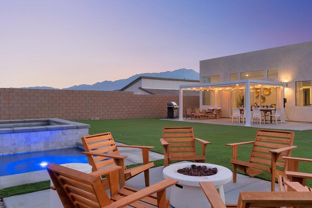 Don't miss this opportunity, this property is just 4 years new with just under a 1/4 acre lot and a MASSIVE pool built in location to maximize panoramic views and provide plenty of entertainment space right off the patio. This home has tons of upgrades, built for efficiency and the maximum number of solar panels allowed, ALL PAID FOR! Great property for a vacation home or an excellent Rental! Located in a City Opportunity Zone which offer great tax benefits.