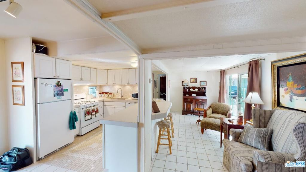 Welcome to Horizon Mobile Village - The All Ages Community! Just reduced to $64,900.00, the seller is open to all reasonable offers! The spacious living room area includes a dining area and the open kitchen with the counter separation between the two areas. The bedroom features a bed area and desk space. The home is located in the area at the base of Southridge where the iconic Bob Hope is located - high above and the Rim Rock Condominiums as well. The community features a fenced and heated Pool and Spa in a whimsically decorated motif. Horizon Park is close to all that the Desert has to offer including downtown Palm Springs nightlife and entertainment, Palm Springs International Airport, Trader Joe's and Target and various mountain hiking paths that begin just behind the park! According to the management office, the space rent for a new owner will $750.00 per month. Welcome to your new home!