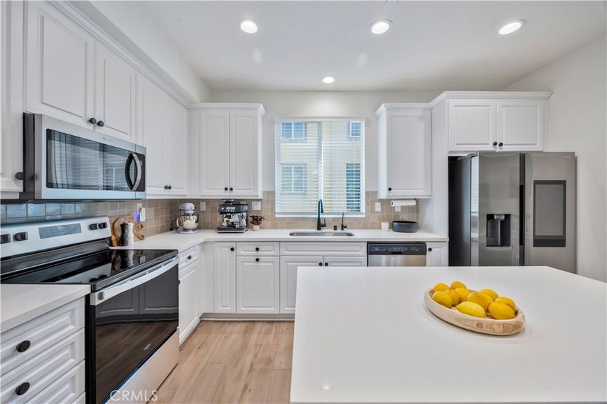 Welcome home to 173 Mission Villas Road, a highly upgraded condo in the Mission Villas community of San Marcos! Built in 2023, this newer construction home features 2 bedrooms and 2.5 bathrooms, with no one above or below. With over $35,000 in upgrades, it offers luxury vinyl plank flooring throughout, dimmable recessed lighting, a water filtration system, and fully owned solar. The main level showcases an open-concept floor plan with a private balcony and a beautifully upgraded kitchen featuring stainless steel appliances, soft-close cabinetry, quartz countertops, a designer backsplash, black hardware and faucet, and a single-basin undermount sink. Off the living room, you’ll find a powder room with a beveled mirror and pedestal sink—perfect for guests. Upstairs, the spacious primary suite offers a generous walk-in closet and an en-suite bathroom with a dual-sink vanity and walk-in shower. The secondary bedroom also includes an en-suite bathroom and a stylish accent wall. A laundry closet with stackable washer and dryer, cabinetry for extra storage, and hanging space is conveniently located on the same level. The attached 2-car garage provides direct access to the home and has been upgraded with epoxy flooring and is wired for electric vehicle charging. The community offers amenities such as a bocce ball court, BBQ area, and playgrounds. This prime location is just minutes from the 78 freeway, CSU San Marcos, the Sprinter station, shopping, dining, and more!