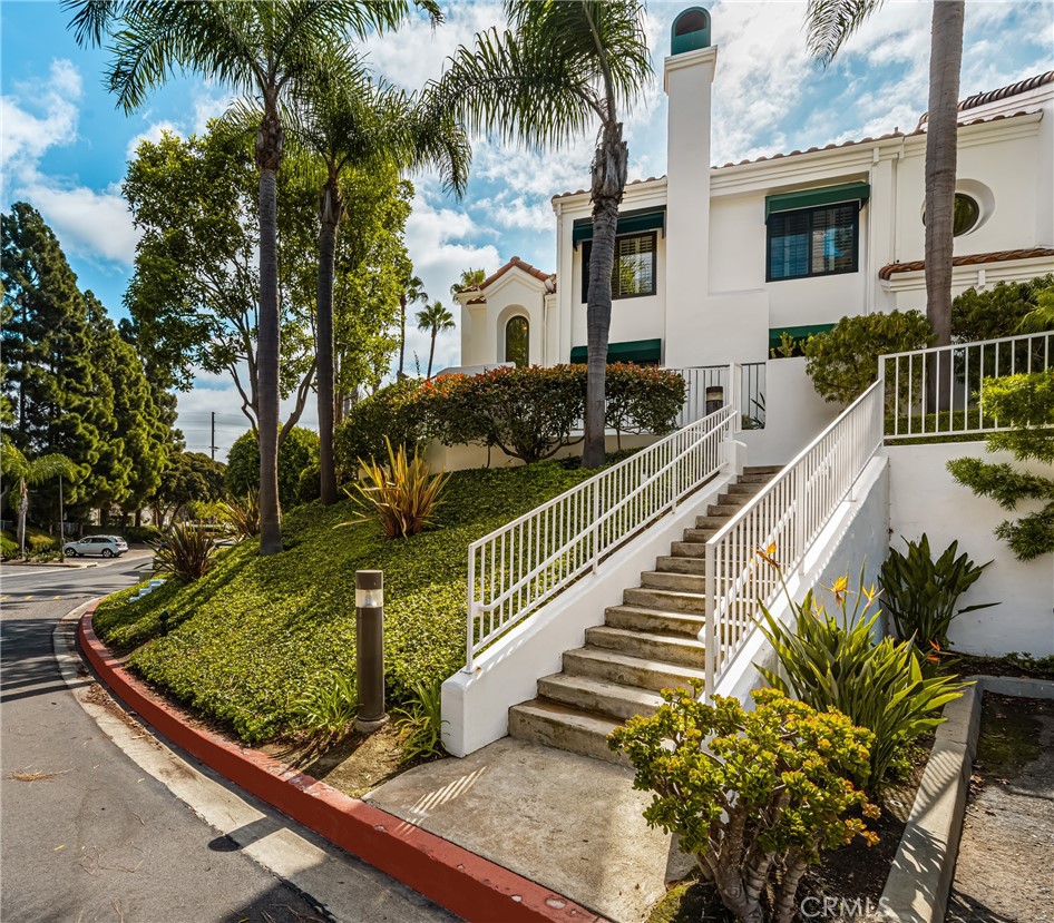 Welcome to your dream retreat just two miles from the ocean in the heart of Huntington Beach. This stunning corner unit offers two private outdoor spaces surrounded by lush greenery, including one with a pool view. Inside, the spacious multi-story home features high ceilings, abundant natural light, a cozy fireplace, and a separate dining area, creating a bright and airy atmosphere. A rare three-car garage adds incredible convenience, while the home’s history of being lovingly maintained by just one family makes it truly special