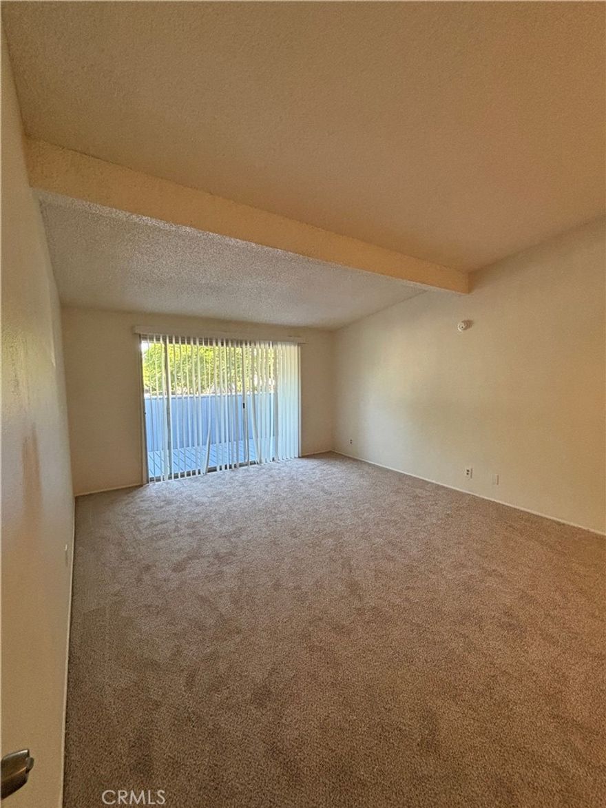 Spacious second floor 3 bedroom, 2 bathroom unit with an open floor plan. It has a large walk-in closet with ceramic tile flooring in the kitchen and dining area, and wall-to-wall carpeting in the bedrooms. It has an assigned carport parking. This home is close to local schools, shopping, and employment areas. This home is 3/4 mile east of Centennial Park. Centennial Park 69.50-acre park with picnic areas, basketball courts, a skate park, playground, and a lake.