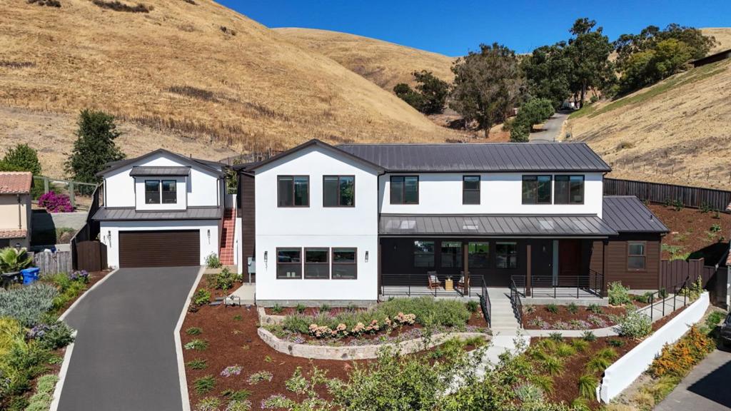 Stunning New Custom Home with Bay & Hills Views in Fremonts Orchard Heights. Welcome to this extraordinary brand-new home located in the prestigious Orchard Heights subdivision of Fremont. Perched at the top of a quiet cul-de-sac, this home offers sweeping panoramic views of the lower San Francisco Bay from the front and backs directly onto the scenic Mission Hills.  The main residence spans a 4,341 square feet of thoughtfully designed living space with 4 bedrooms each with its own en-suite bathroom. Also, an expansive upstairs loft provides a flexible space thats perfect for a media room, home office, or recreational area. The heart of the home is the open concept living area, filled with natural light from numerous large windows that frame the stunning views. The large chefs kitchen featuring a generous island, top-tier appliances, and a charming breakfast nook. A standout feature of the property is the fully permitted 400-square-foot Accessory Dwelling Unit (ADU), located above the detached garage and complete with its own address. This private unit includes a full kitchen, a walk-in closet, and a bathroom. The ADU offers an unobstructed view of the bay to the front and the rolling hills behind, making it ideal for extended family, guests, or potential rental income.