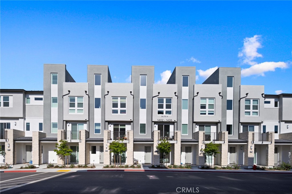 Located in the gated 100 West community by Toll Brothers, this contemporary four-story home offers modern design and convenience in the heart of Anaheim.
The entry level features a private bedroom with full bath, perfect for guests or an office. The main floor highlights an open-concept layout with a spacious living area, dining space, and gourmet kitchen with sleek white cabinetry and center island. Two patios extend the living space for an indoor/outdoor lifestyle.
The upper levels include a luxurious primary suite, additional bright bedrooms, and an expansive rooftop deck ideal for entertaining or relaxing. An attached two-car garage, abundant windows, and secure gated setting complete the home.
Just minutes from Disneyland, Angels Stadium, Honda Center, shopping, and dining, this residence combines vibrant city living with the comfort of a private retreat.
