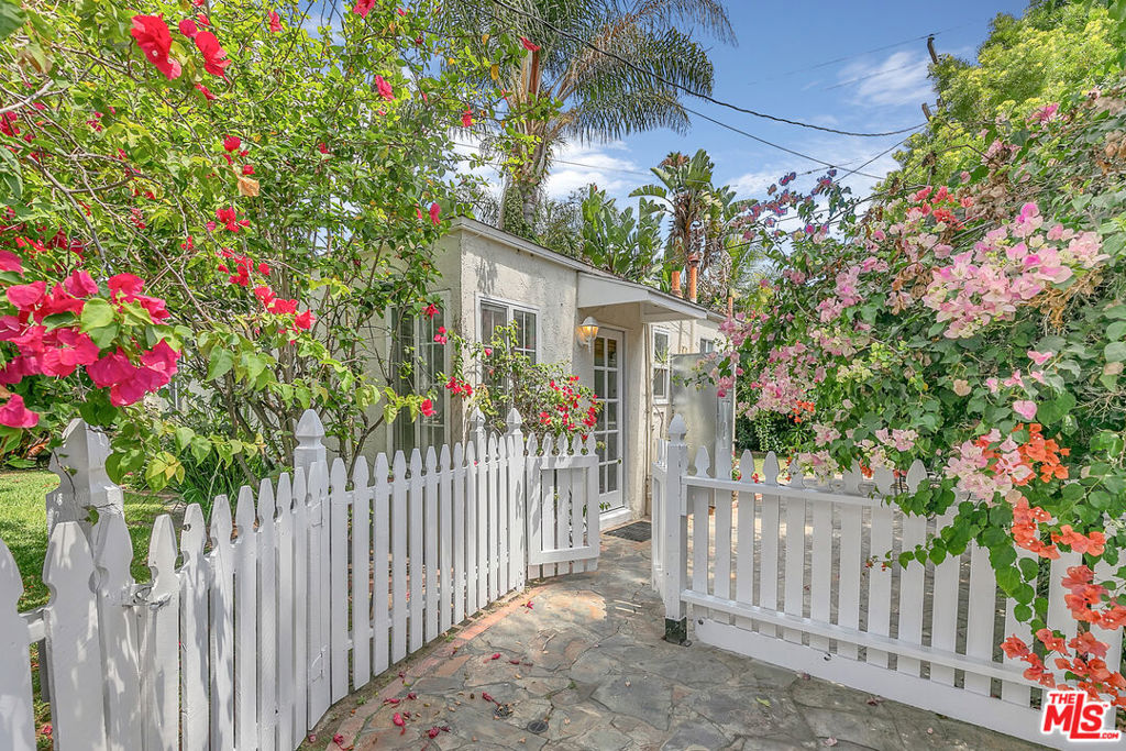 Tucked behind a white picket fence and bursting with colorful blooms, this fully detached 1-bedroom, 3/4 bath home feels like your own secret garden hideaway. Technically part of a duplex, but trust usit lives like a private cottage. The real showstopper? That gorgeous outdoor space. Whether you're dreaming of a veggie patch, a succulent sanctuary, or just a shady nook for sipping your morning coffee, this yard is your blank canvas. Bonus: Your furry friend is totally welcome! Inside, the vibe is sweet and simple with lots of natural light and charming vintage touches. The white-on-white kitchen is bright and functional with a gas stove, fridge, and cute garden views. There's a cozy living space with mirrored closets, and a full bath with clean lines and good light. It's quaint, it's quiet, and it's calling your name. Need laundry? We've got you coveredthere are washer/dryer hookups on-site, so just bring your machines and you're all set. And the location? Chef's kiss. You're nestled in Westside Village, within walking distance to literally everythingshops, coffee, restaurants, the Metro, and more. It's the perfect mix of city access and cottage-core calm. Come take a look and see why this one's a total unicorn!