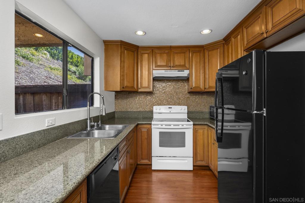 Welcome to your serene escape in the heart of San Diego! This spacious, 2-story condo at Gold Creek Condominiums in Mira Mesa, offers the perfect blend of comfort and convenience. With two Large bedrooms, each featuring its own private balcony, you can enjoy your morning coffee or unwind in the evening with a view. Step inside to discover a warm and inviting living space, highlighted by a cozy fireplace that creates an ideal atmosphere for relaxation. 2 Large Bedrooms upstairs are opposite each other maximizing privacy. Large, mirrored closets with custom, built-in shelving and drawers provide ample storage while maintaining a sleek aesthetic. The well-appointed kitchen has a window overlooking a private patio, perfect for outdoor dining or entertaining friends. Full bathroom with bathtub is located upstairs plus a convenient half bath downstairs, along with a full-size stacked washer and dryer for your laundry needs. One assigned parking spot, plenty of street parking and easy access to the 15 freeway, making your daily commute a breeze. Relax at the community pool, where you can soak up the sun and connect with neighbors. With major shopping, restaurants and Hourglass Park just moments away, everything you need is at your fingertips. Professionally cleaned and updated with new electrical and smoke/CO2 detectors for peace of mind, this condo is vacant and ready for you to call home. Experience the vibrant lifestyle and convenience of Mira Mesa and make this spacious condo your home!