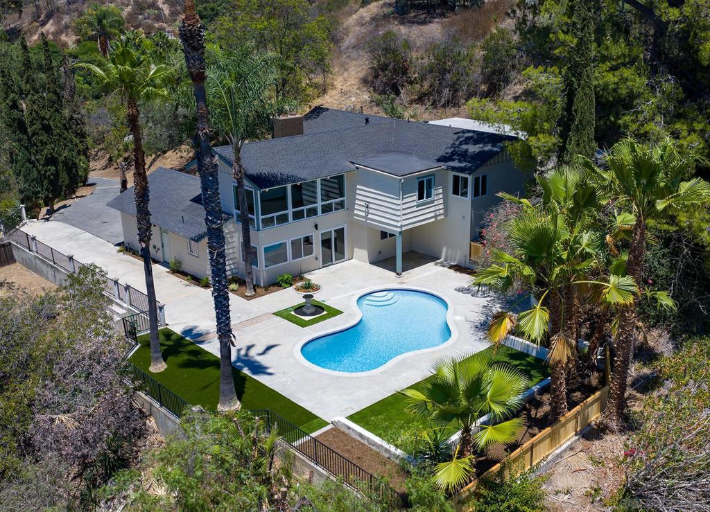 WANT TO AVOID THE HUSTLE AND BUSTLE OF A CROWDED CITY LIFE? THIS IS TRULY A PRIVACY GEM, FULLY REMODELED AND LIKE NEW. PANORAMIC VIEWS TO ENJOY FROM EITHER YOUR LIVING ROOM, KITCHEN/BREAKFAST AREA, OR BEDROOM. THE PROPERTY SITS ON OVER AN ACRE AND ATOP GEM HILL LN, SURROUNDED IN PRIVACY AND TREES! WIND YOUR WAY UP THIS SEMI-RURAL NEIGHBORHOOD ROADWAY, WITH NO STREET LIGHTS TO BLOCK YOUR VIEW OF THE STARS, BUT BE WITHIN 35 MINUTES OF MOST ANYWHERE YOU NEED TO GO IN SAN DIEGO--FROM LA JOLLA SHORES, TO DOWNTOWN SAN DIEGO, AND LINDBERGH INTERNATIONAL AIRPORT. FISHING AND BOATING JUST MINUTES AWAY AND MILES OF HIKING TRAILS A FEW BLOCKS NORTH (SEE MAP IN PHOTO GALLERY.). NEWLY REFINISHED POOL FOR ENTERTAINING PLUS BEAUTIFUL FOUNTAIN. TWO FIREPLACES, CENTRAL AIR, ALL NEW APPLIANCES, A HOST OF NEWLY BUILT IMPROVEMENTS AND EXTRAS (SEE SUPPLEMENT BELOW). 4TH BEDROOM ORIGINALLY A DEN, NOW CONVERTED WITH NEW CLOSET, WITH EXTRA 1/2 BATH ADDED BY PREVIOUS OWNER. VIRTUAL STAGING USED WITH PHOTOS. ONCE YOU SEE IT, YOU'LL BUY IT. New 200 amp electrical service 50 amp plug in the garage for electric cars All the wiring has been replaced, outlets, switches etc upgraded with ground wires. Can lighting throughout All new appliances pool equipment refreshed, new filter mesh New pool plaster, tile and coping New skimmer Automatic pool filler New roof Fresh paint inside and out All new hard flooring, same throughout Master bathroom Double sinks New tub in full bath All New tile in master Glass door from master bedroom to patio All new lighting fixtures Deck for jacuzzi Two fireplaces Open beam ceiling is insulated All new cabinetry, wood grain Air conditioning fully serviced Ducting re insulated New drain line to septic All new plumbing Dual pane windows with bevel glass on the inside for easy cleaning New garage door opener New ceiling fans with remotes 100 ft rv / trailer parking New shaded private patio. Slab for jacuzzi. Charge plug for electric car. Epoxy garage floor