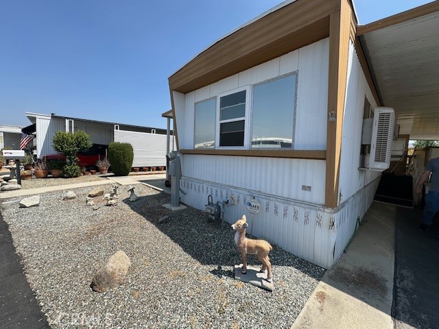 55+Very Scenic Park of Vogue Manor. Park is small peaceful and clean with amazing views. The 1/1 is neat as a pin and has a complete open view out the front windows of the San Jacinto Mountains. Ths home has been upgraded with new indoor outdoor carpeting on the extra room approximately a 8 x 28. New Laminate flooring. There is a big side yard and the back part of the home has fencing for a furry friend. New swamp cooler. Separate bathtub and a walk in shower. There is a aluminum walk in storage bldg .at the end of the driveway. New swamp cooler. Affordable park rent of $665.00. This home is Move-in ready. This Park offers Swimming Pool, Jacuzzi, Billiards, Library, Clubhouse with Kitchen, Laundry room and more.