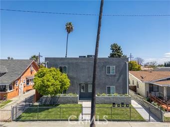 This beautifully illuminated duplex, just two years old, boasts an array of modern features, including elegant quartz countertops, white self-closing cabinets, and attractive laminate flooring throughout. The spacious living room and bedrooms provide ample room for relaxation, while the contemporary bathrooms enhance the overall appeal. Additional highlights include solar energy provisions, a two-car garage, and a prime location conveniently situated near shops, banks, and fine dining establishments.