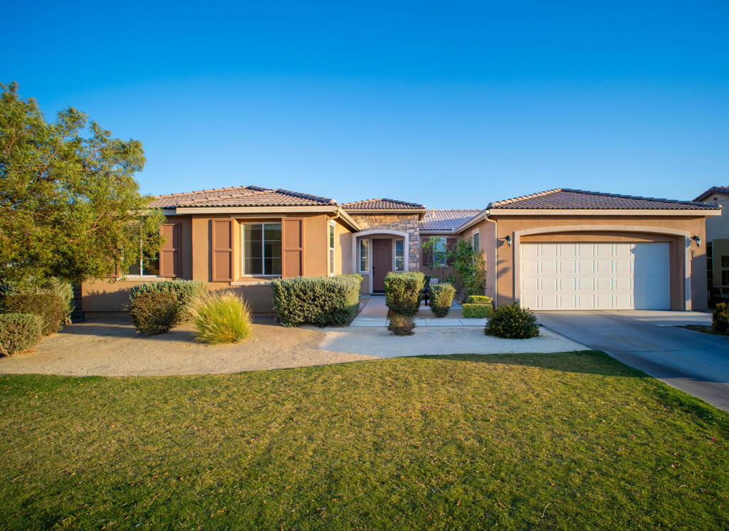 Imagine yourself living at 82947 Larsen Drive where comfort, style, and possibility come together in the heart of Indio's sought after gated community, Desert Trace. From the moment you step inside, you'll feel the warmth of a home that's been lovingly cared for. The heart of the home is the expansive great room that flows into a bright dining area and a beautifully designed kitchen that's equal parts functional and elegant. Picture yourself gathering around the oversized island, sharing meals and memories. Need to get things done? The indoor laundry room keeps chores simple. Prefer to unwind? Head out to the covered patio, where the spacious backyard is ready for your personal touch imagine a sparkling pool, lush garden, or cozy fire pit under the stars. You're just minutes from shopping, dining, golf, and easy freeway access. With low HOA fees, this home is not just a smart investment it's your next chapter. Whether you're searching for your forever home or a desert getaway, 82947 Larsen Drive is ready to welcome you. All that's missing is you.
