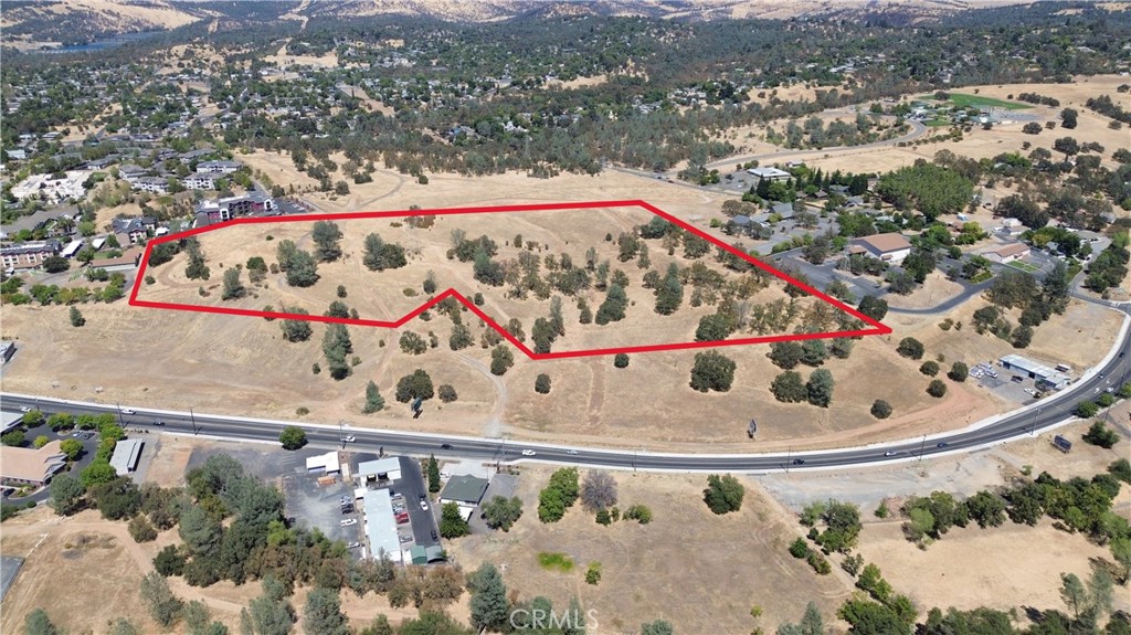Outstanding 18+ acre commercial development opportunity with C-2 Intensive Commercial zoning and spectacular 360-degree views of Sutter Buttes, foothills and valley. Located within Oroville city limits adjacent to recently built hospital and thriving multi-family construction. C-2 zoning permits extensive commercial uses including retail, restaurants, hotels, gas stations, car washes, vehicle sales, offices, schools, manufacturing and more. Gradual slope maximizes development potential while preserving sweeping views. Established access and municipal services. Strategic location in established growth corridor with strong market demand from healthcare expansion and residential development. Turnkey opportunity for mixed-use, retail, hospitality or specialty commercial projects. Ready for immediate development.