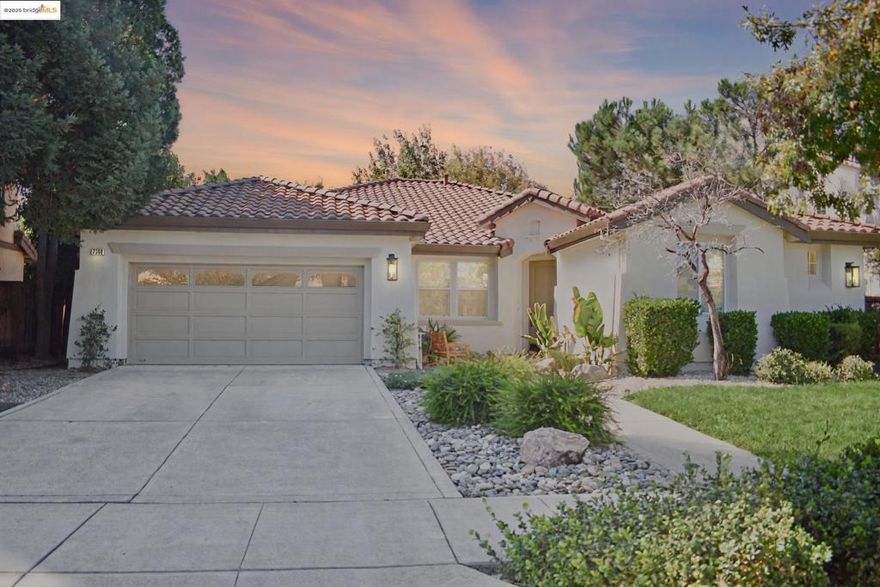 Experience effortless elegance in this beautifully updated single-story Mediterranean home. With 4 bedrooms and 3 full bathrooms across 2,774 sq ft, this residence features an open-concept layout ideal for modern living. The gourmet kitchen boasts granite countertops, stainless appliances, gas cooktop, and a double oven with a dramatic cobalt blue interior. Light-filled living and dining areas feature luxury vinyl plank flooring and designer fixtures. A flexible front room is perfect as a home office or guest suite. The spacious primary suite offers patio access, dual closets, and a spa-inspired en suite with soaking tub and walk-in shower. Enjoy indoor-outdoor living in the lush backyard with mature trees and space to relax. Nestled on an 8,712 sq ft lot in a desirable Brentwood neighborhood near schools, parks, and shopping. Stylish, spacious, and move-in ready — this home is a rare find!