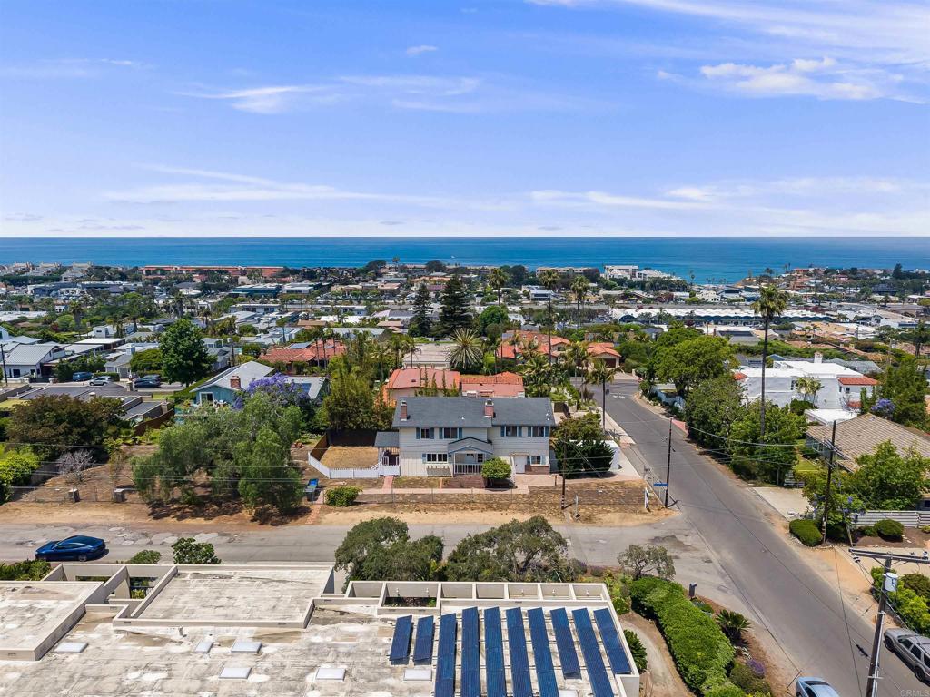Rare opportunity! More than a third of an acre (.39) of flat usable land with white-water ocean views in West Solana Beach. New carpet. New inside paint. Huge yard. This home is located on the corner of Corto & Via De Vista, a private street ideally located in the center of Southwest Solana Beach. The possibilities are endless with this lot and location! City of Solana Beach Planning Department says the max house build is 4775 sq ft. Anything above 2865 would require City Council approval. Great ADU potential. Max ADU size is 800 sq ft. Buyers to verify this information themselves with City of Solana Beach.