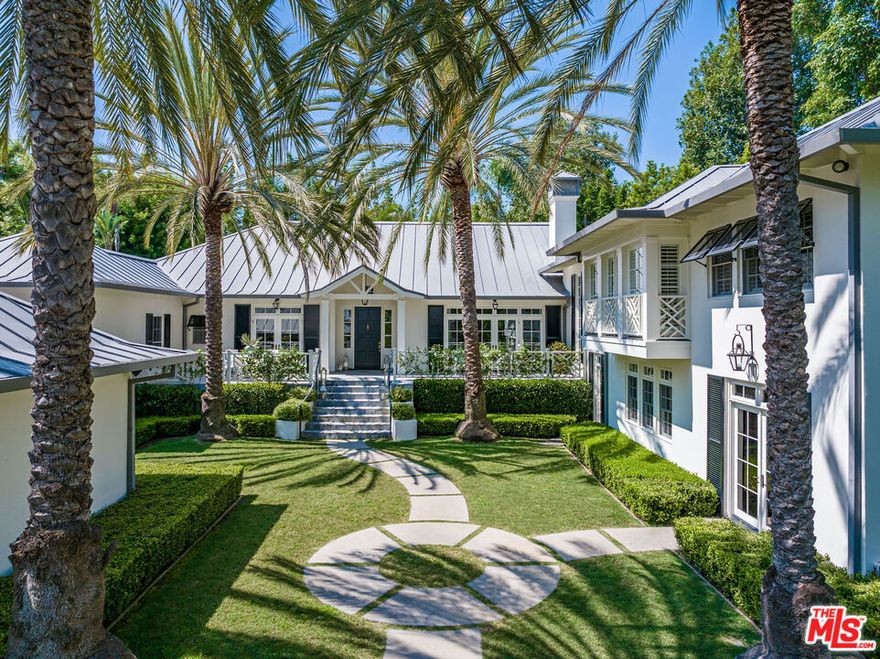 Caribbean Fantasy in Brentwood Park. A classic example of coastal design which punctuates the gentle islands of the Caribbean and Bahamas, this elegant and sophisticated Brentwood Park estate will tug at your heartstrings and completely disarm the most ardent traditionalist. Situated in a tranquil and secure 24,750sqft garden oasis, with exceptional privacy, it breathes a charismatic architectural style, rich authenticity and a sense of calm. Vaulted ceilings, polished walnut floors, exquisite details and seamless indoor/outdoor living blend in perfect harmony. Four beautiful bedrooms, staff wing, stunning kitchen/great room, separate gym and an exceptional primary suite. Multiple fireplaces, rolling lawns, swimmers pool, specimen palms, three-car garage, broad terraces and fragrant gardens.