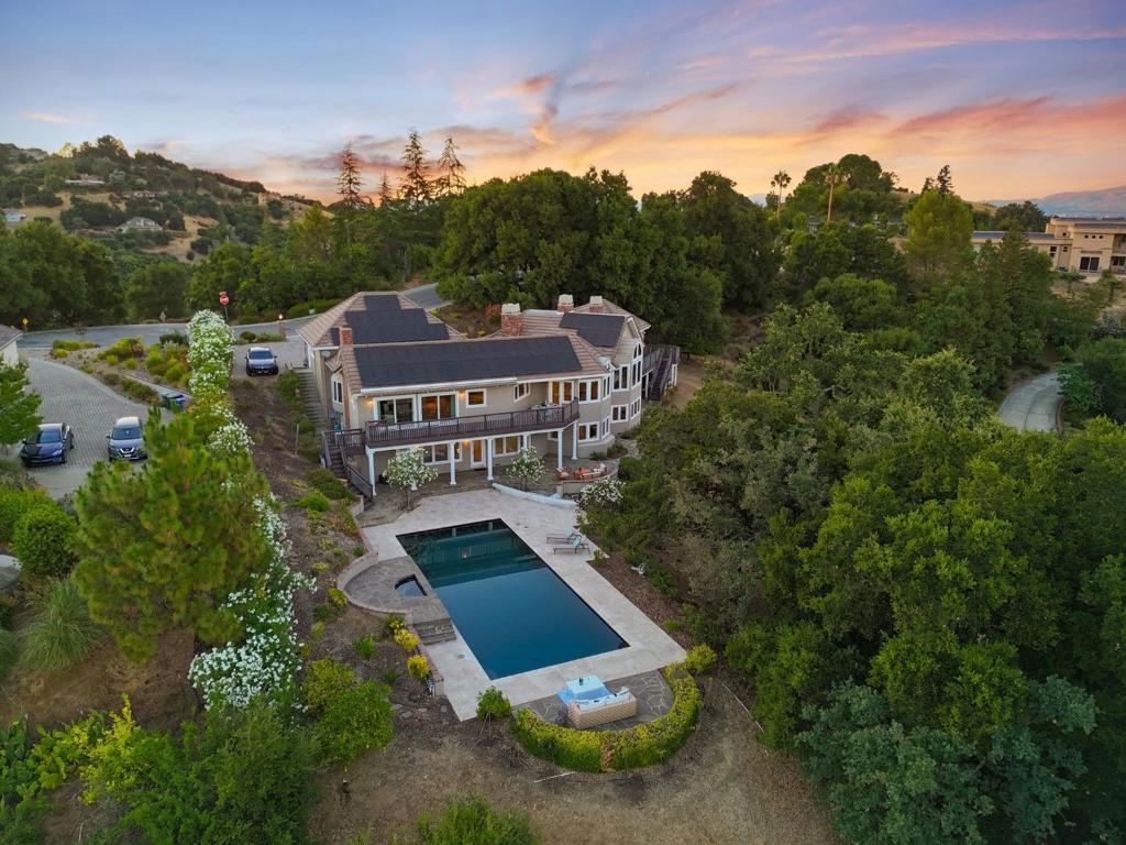Welcome to 21415 Continental Circle, a two-story private executive estate with spectacular valley views in Saratoga located in the exclusive Parker Ranch area. This home features 4 bedrooms plus a separate office, 3 full bathrooms and a powder bathroom. The inviting front yard is professionally landscaped with mature trees and foliage. The formal entry has a large display niche for your treasured artwork. The gourmet kitchen is a chefs dream with stunning views and plenty of space to cook and entertain, featuring custom cabinetry and top of the line stainless steel appliances. Open floor plan from the kitchen to the family room that opens to the backyard deck. Amazing grounds with a beautiful pool + spa is a sanctuary to enjoy great gatherings. Conveniently near commuter routes such as 9, 85 and Saratoga Sunnyvale Road. Just a few minutes away from downtown Saratoga and Cupertino Main with fine dining and shopping. Award-winning Monta Vista High.