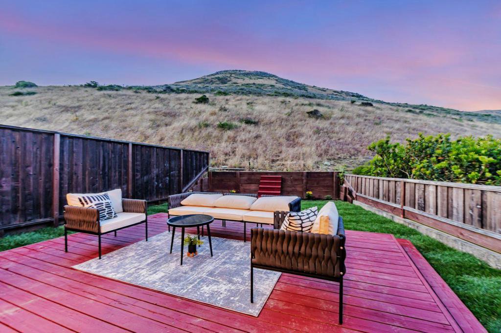 Peaceful Terrabay Retreat with Bay Views & Private Yard Located at the top of the Terrabay community, this serene and light-filled home offers an exceptional living experience with beautiful views of the Bay and surrounding hills. Nestled against San Bruno Mountain with no rear neighbors, this property provides a rare sense of privacy and tranquility. The main level features a bright and open floor plan, complete with high-end wood flooring, a spacious living room with fireplace, and a large walk-out front deckperfect for relaxing or entertaining. The updated kitchen and breakfast area open directly to the generous backyard, creating a seamless indoor-outdoor flow ideal for gatherings or peaceful mornings. Upstairs, you'll find two spacious bedroom suites, including a primary suite with a luxurious en-suite bathroom featuring dual sinks and ample storage. Situated on a corner lot, the home is filled with natural light throughout. The private yard and expansive front and rear decks offer great space for BBQs. Enjoy the benefits of a well-maintained community built in 1997, with convenient access to Highways 101 and 280, and just minutes from San Francisco.