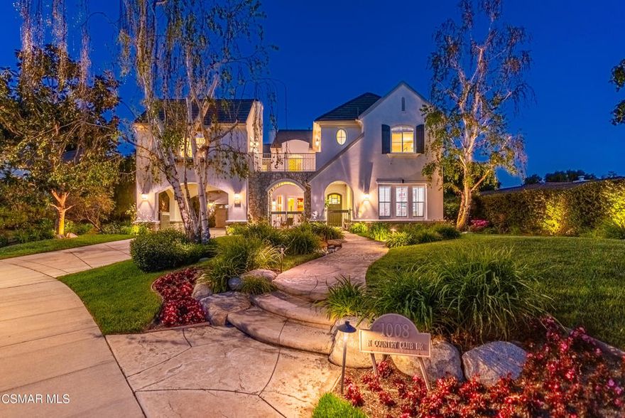 This exquisite home stands proudly on a wide interior corner lot offering impressive curb appeal with lush landscaping, porte-cochere and  courtyard entry.The home features a thoughtful layout with a guest quarters and a beautiful staircase right off the entry. The formal living room is perfect for entertaining, with an elegant fireplace and flowing seamlessly into the formal dining room which includes a built-in china cabinet and doors that open to the entry courtyard. The outdoor fireplace, creates a great space to enhance your dining experiance.The kitchen and family room are the heart of the home, offering an open and airy feel. Whether you're gathering around the breakfast bar or sitting in the nook, the modern fireplace in the family room adds warmth and comfort. The kitchen boasts a large walk-in pantry, ample counter space, and high-end Viking appliances that will please any chef. Upstairs, there are four spacious bedrooms. The primary suite is very spacious and quite luxurious with a cozy sitting room with a fireplace and balcony. The tree top views add to this tranquil and private space. The private bath has been redsigned with enlarged shower, soaking tub and large walk-in closet. 2 of the upstairs bedrooms are joined by a bath The 4th bedroom has a private bath. A large bonus room, currently used as an office, is conveniently located near the secondary bedrooms. A detached studio above the porte-cochere adds even more living space, with endless possibilities for use. It's accessible from the upstairs hallway via a bridge walkway, making it a unique feature of the home. The backyard is designed for both relaxation and fun, with a built-in BBQ, infinity-edge pool, and stone waterfalls. A hidden garden/play area sits just behind the pool, offering a private retreat. The 3rd stall garage has been converted to wonderful storage space. Westwood Ranch is located in the beautiful Wood Ranch area and is close to Regan Library and 23 frwy for quick access to Conejo Valley. This home offers plenty of space, modern amenities, and a great layout for living and entertaining.