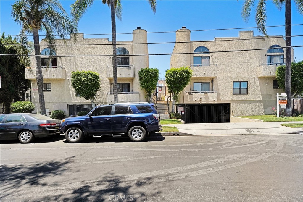 Spacious two-bedroom, two-and-a-half-bath townhouse-style unit with a large, bright living room. Both bedrooms are upstairs and feature high ceilings and large closets. In-unit washer and dryer for added convenience. Includes a two-car secured garage and is located in a gated, secure building. This is a small, quiet complex. The unit does need some TLC, offering a great opportunity to make it your own.