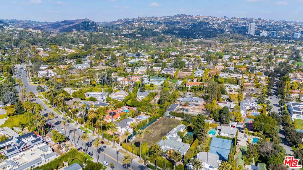 This property awaits your new dream home. Located on the East side of the street, Prime Beverly Drive, in the flats of Beverly Hills. Public records reflect 93 foot frontage, Title rep correcting it to a 100 foot frontage. Buyer shall verify, and do their own due diligence. Properties of similar size lots with newer construction selling in 25 - 30 million plus range. As the saying goes, build them and they will come! This is a very unique opportunity, and hard to find a dirt lot that commands $$$$$. Priced aggressively. Please see attached PDF from the title company under "documents". Dont miss out !!