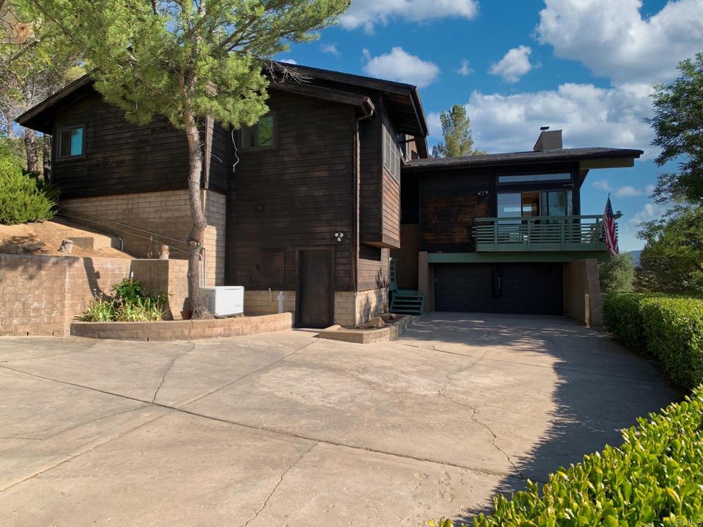 Welcome to your mountain paradise retreat! This gorgeous custom built, executive home is luxury living amongst beautiful pines! This home offers 3 bedrooms, 2.5 bathrooms, with panoramic views from the large deck, 3 fireplaces to keep you cozy on chilly nights, a Generac auto start generator, central vacuum system, and the primary retreat shows more like a penthouse, spacious with the amazing views! Enjoy your morning coffee or evening wine in your expensive deck with million dollar views! Definitely country living at its BEST! This home is sold with adjoining vacant lot, totaling over 2 acres for both!!!
