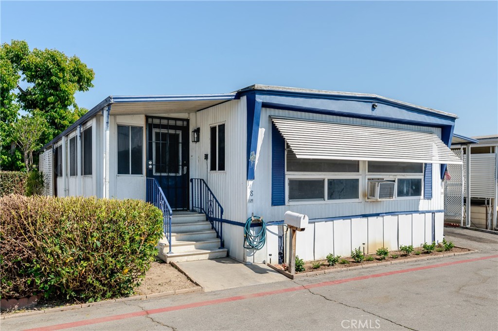 4800 Daleview Avenue, #148 in El Monte is located in the desirable Daleview Estates for seniors 55+ mobile home park. This property is a diamond in the rough awaiting your ideas and designs for updating and remodeling. This home is a fixer, sold in as-is condition. Cash offers only. The mobile home offers 1,100 square feet of living space, an enclosed porch currently used as a bonus room, spacious living room, a dining area with built-in hutch, an unfinished kitchen and a separate laundry room. The home has a total of 2 bedrooms and 2 bathrooms, including the primary bedroom suite. The lot space includes 2-car carport parking and 2 storage sheds. The park has a sparkling community pool and spa, clubhouse with tables and chairs, game room with pool table, plenty of guest parking, a walking path with sitting areas among lush gardens, and a covered barbecue area with picnic tables for outside entertaining.