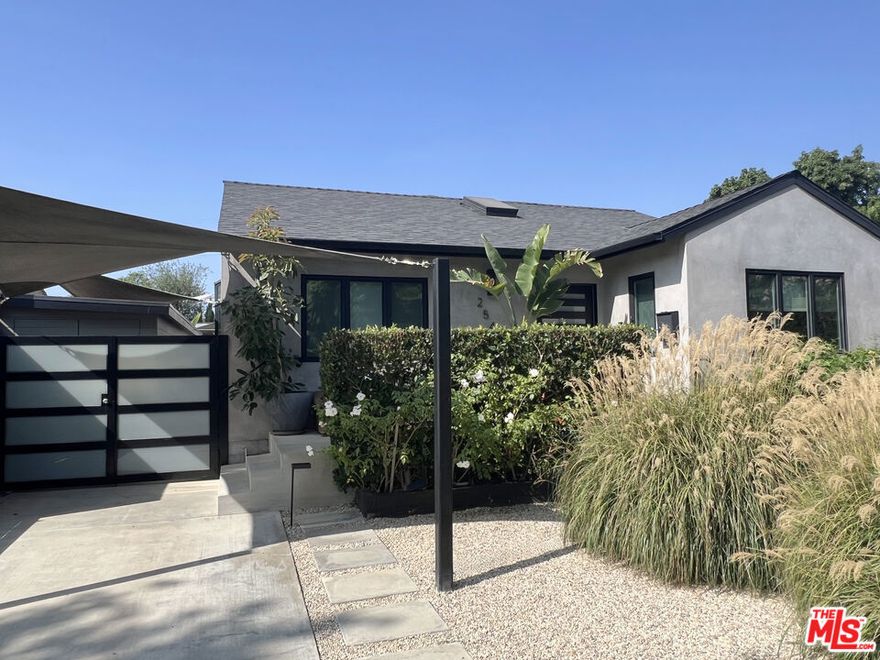 Modern comfort paired with effortless entertaining  - a thoughtfully designed home that blends style and function. The floor plan is open and inviting with abundant natural light and skylights throughout. Main house is 1,945 SF and the detached deluxe garden apartment adds another 380 SF complete with hidden storage and full bathroom.  The home draws you in with its modern, bright and warm vibe: clean sight-lines, and wide-plank hardwood floors that lead you from the open living room into a chef's kitchen any cook will enjoy. Ultra-modern stainless Miele appliances and induction stovetop. The wide center kitchen island serves as a bar and makes gatherings enjoyable.  The primary bedroom suite offers both space and refinement, with expansive walk-in closets and a spa-like bath highlighted by a rain shower, plus hand shower. Every full bathroom in the home includes both a tub and shower - a thoughtful detail for families and guests alike.  Beyond the main house, a deluxe 380 SF garden house offers a private bath and large sliding doors that lead into the garden - ideal as a guest retreat, studio, home office or potential income space. The yard is an entertainer's dream: low-water Tuscan gravel landscaping, productive mature lime tree out front, and distinct zones for dining and lounging beneath the lights.  Sustainability and convenience are built in - rooftop solar with a Tesla Powerwall (installed last year) and a 240V EV charging station mean lower bills and fewer compromises. Central HVAC serves the main house while efficient mini-splits cool the primary bedroom suite and the garden apartment.  Set on a quiet, tree-lined street with friendly neighbors, the home is an easy stroll to neighborhood markets and coffeehouses. The nearby elementary school is top-rated and known for its highly regarded French immersion program. With immediate access to the 10 and 405 freeways, this is modern Federal Avenue living  smart, stylish, and comfortable. The garden provides a calming Zen oasis in the middle of West LA.