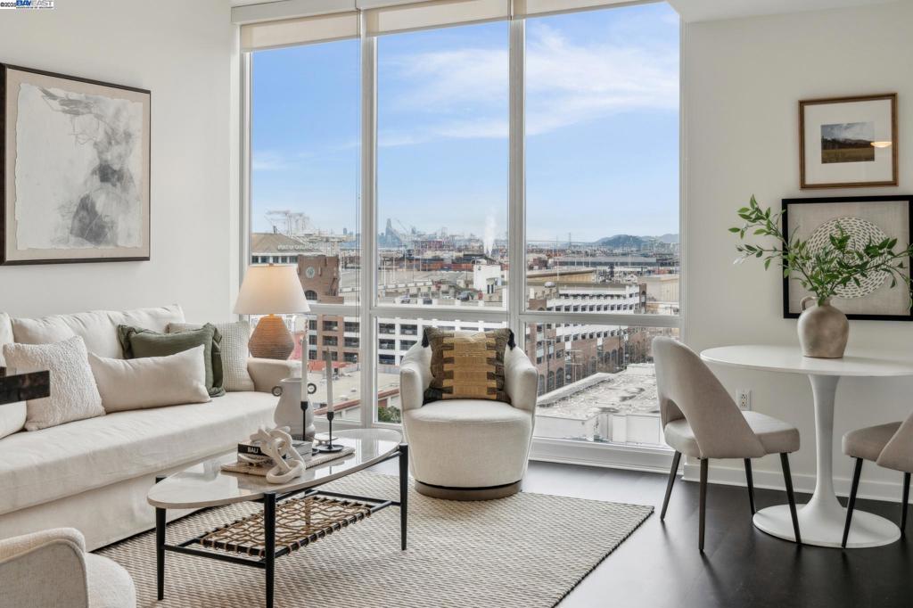 Large one-bedroom, one-bath condominium is immersed in views of the Bay, Golden Gate, and San Rafael bridges through spectacular floor-to-ceiling windows and a balcony that beckons a very Happy Hour bathed in sunset views of sailboats and Saturday night. Moody tones give this home an air of timeless sophistication with a punch of sassy urban culture. The kitchen marries rich mahogany color cabinets with a refined tile backsplash add a powerful air of elegance. The bedroom is extraordinary. Dramatic and enormous. Sleep among the sparkling city lights. Watch the ferries come in and the sailboats gracefully glide about, all within the comfort of your sheltered private balcony. A walk-in closet with detailed closet organizers offers great space and amazing storage. Crazy great value! The Ellington is a modern full-service high-rise with 24/7 concierge, a beautiful pool deck with heated pool, spa, showers, and BBQ. It also has an impressive fitness center, and a terrific community lounge, with full kitchen, tables, soft seating, and DirecTV™. This is luxury urban living at its finest. Walking distance to incredible restaurants, wineries, breweries, music venues, art galleries, and more. Enjoy kayaking, paddle boards, boating, and the beautiful Bay Trail.