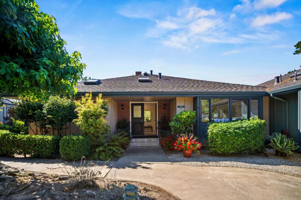 Tucked away in a serene, private setting above the treetops, this exquisite "B" model captures breathtaking vistas of the Santa Lucia Mountains, Pacific Ocean, and spectacular sunsets. Light-filled and expanded, it offers soaring ceilings, fresh paint, new carpet, a cozy fireplace, & a delightful garden-view kitchen with all-new appliances. Walls of glass open to a sweeping wrap-around deck, an ideal retreat for morning coffee or sunset entertaining. Sit back and take in the awesome views of Pt. Lobos, Monastery Beach, Carmel State Beach & Pebble Beach. Designed for comfort & tranquility, this home provides thoughtful updates and abundant storage throughout. Nestled within the prestigious retirement community of Del Mesa Carmel, this is where residents enjoy a vibrant lifestyle surrounded by natural beauty and first-class amenities: Highly acclaimed Woody's Restaurant & Lounge, spectacular grounds, lawn bowling, pool, spa, gym, cultural events, parties, 24/7 guard-gated security, on-site maintenance, and a warm, welcoming spirit of community. Just minutes to world-class restaurants, shopping, golf, tennis, hiking, vineyards, and the scenic coastal drive down Highway 1. Experience the ultimate blend of serenity, sophistication, and community, all in one remarkable setting.