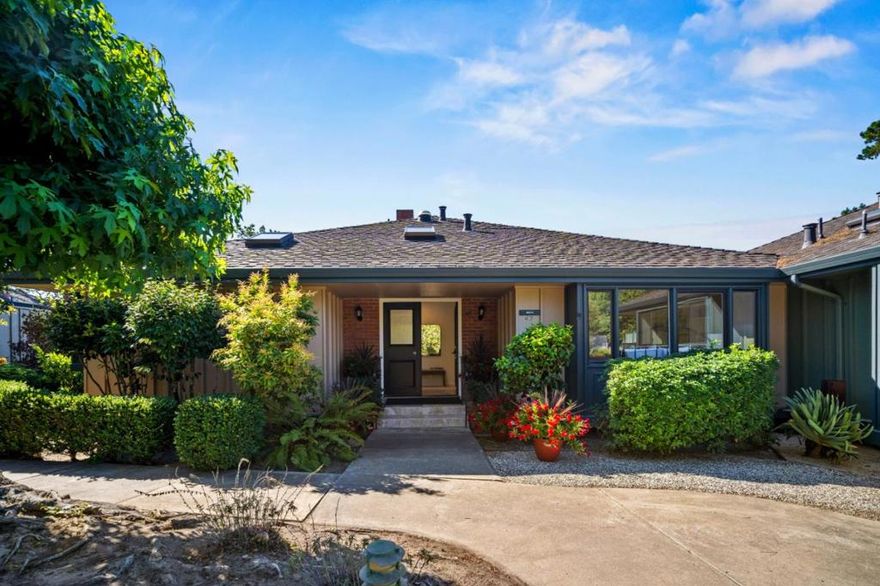 Tucked away in a serene, private setting above the treetops, this exquisite "B" model captures breathtaking vistas of the Santa Lucia Mountains, Pacific Ocean, and spectacular sunsets.  Light-filled and expanded, it offers soaring ceilings, fresh paint, new carpet, a cozy fireplace, & a delightful garden-view kitchen with all-new appliances.  Walls of glass open to a sweeping wrap-around deck, an ideal retreat for morning coffee or sunset entertaining. Sit back and take in the awesome views of Pt. Lobos, Monastery Beach, Carmel State Beach & Pebble Beach.  Designed for comfort & tranquility, this home provides thoughtful updates and abundant storage throughout.  Nestled within the prestigious retirement community of Del Mesa Carmel, this is where residents enjoy a vibrant lifestyle surrounded by natural beauty and first-class amenities: Highly acclaimed Woody's Restaurant & Lounge, spectacular grounds, lawn bowling, pool, spa, gym, cultural events, parties, 24/7 guard-gated security, on-site maintenance, and a warm, welcoming spirit of community.  Just minutes to world-class restaurants, shopping, golf, tennis, hiking, vineyards, and the scenic coastal drive down Highway 1.  Experience the ultimate blend of serenity, sophistication, and community, all in one remarkable setting.
