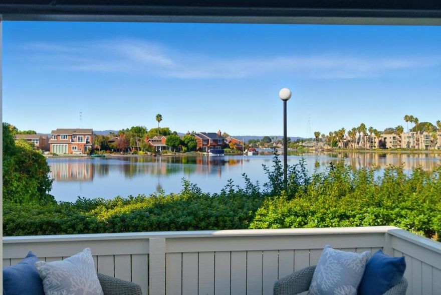 Experience serene living in this inviting two-level townhome with captivating wide water views. Newly painted interior, refinished hardwood floors, and new carpet enhance its charm. Featuring two bedrooms, 2.5 bathrooms, and a versatile den/study, it also includes a two-car garage and convenient laundry. Relax on your back patio by the bay and enjoy the easy access to the bay trail.