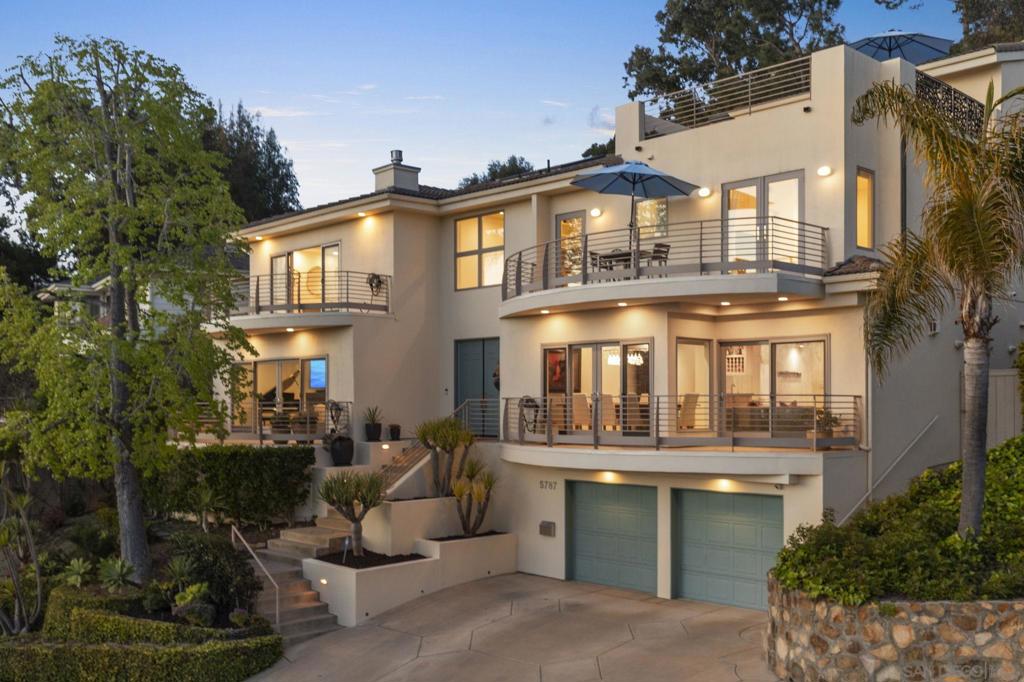 Ocean views and sun-filled La Jolla Contemporary home is perfectly located just three blocks from the vibrant shops and restaurants of Bird Rock, yet nestled on a quiet neighborhood street. With voluminous spaces, an inviting feel, and an artful blend of beach vibes and designer touches, the home offers all ensuite bedrooms and the best of SoCal living. New updates include 2 renovated baths, recessed lighting, and new paint throughout. Highlights of the primary suite include gorgeous ocean views, a private balcony, a new fireplace surround, and three closets. The eat-in gourmet kitchen opens to a private back patio for dining, entertaining, and a hot tub for relaxation. The upper level features a newer built 200 sq ft bonus room with glass doors opening to an expansive ocean view rooftop terrace that offers more space for outdoor entertainment or relaxation. An elevator takes you to multiple levels. With easy access to the beach and the popular main district of Bird Rock, and great interior and exterior appointments, this contemporary is a can’t miss!