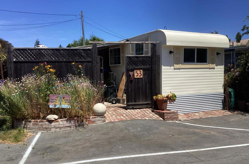 Affordable housing in Santa Cruz! Own a share of this "All Age" Co-op park within walking distance of everything downtown! This home is situated on a corner lot, one of the largest in the park, and features two parking spots. DON'T miss out on one of the best units in the park! This light and bright home features a remodeled kitchen, Dual pane windows, a PRIVATE PATIO, and a HUGE Storage Shed with electricity! Additionally, the full bathroom is separated (one featuring a washer/dryer, sink, and toilet, the other has a full shower and sink)! Two pets are allowed. Income limitations apply, and board approval is required for ownership. Many of the residents in this park have lived here for decades and love it. NEW PHOTOS TO COME! Income limits are as follows: 1 person: $111,100, 2 persons: $127,000. The cost of share buy-in is $4478 for 2025 and shall be refunded to the buyer upon future sale. Property taxes are paid twice yearly and are billed through the park. PLEASE NOTE, HOA is $600/month; HOWEVER, it will revert to $395/month after the loan is paid off.