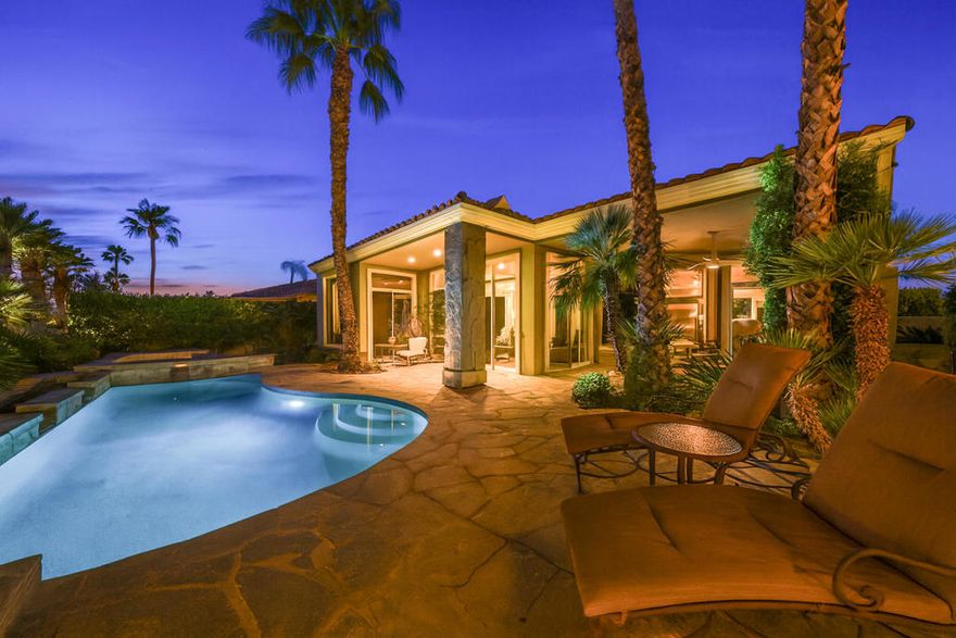 Welcome to this highly sought-after former model Cosio Plan 4 home at PGA West, where sophisticated desert living meets timeless design. Walls of glass frame breathtaking vistas of the lake, fairways, and surrounding mountains--creating a seamless connection between indoor and outdoor living.A lushly landscaped private courtyard with a cascading stone waterfall sets the tone for this serene retreat. Step inside to an impressive granite waterfall entry and an open-concept floor plan adorned with slate flooring, designer carpeting, and recently finished custom paint. The home includes extensive built-ins, a central vacuum system, and thoughtful upgrades throughout.The gourmet island kitchen is a chef's delight, featuring premium Viking stainless-steel appliances, granite countertops, a breakfast nook, and French doors that open to the peaceful courtyard. Four fireplaces--strategically placed throughout the home--enhance the warm, inviting atmosphere.With 3BD & 3.5BA, including two private guest casitas, there's ample space for hosting family and friends. One of the casitas is a two room with a wet bar, and both are accessed from the courtyard.  Outdoor living is equally exceptional, offering Quartzite stone patios, a Pebble Tec saltwater pool and spa with cascading waterfalls, and a built-in BBQ island complete with refrigerator, bar, and a stunning stone fireplace. An elevated upper patio provides a perfect vantage point to take in the spectacular panoramic views.  A two car garage offers ample parking.Offered furnished per inventory, this exceptional property also offers the option of a Premier Golf Membership - delivering access to one of the most prestigious golf lifestyles in the desert.