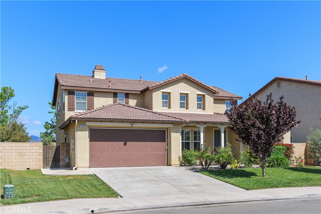 Tucked away in the heart of the coveted Whispering Heights community, this stunning 2-story residence isn’t just a house—it’s the beginning of your next chapter. From the moment you enter this 3,188 sq. ft. masterpiece, you’ll feel the care and craftsmanship that went into every detail. The heart of the home is a gleaming white kitchen adorned with quartz countertops, upgraded cabinetry, and stainless steel appliances. Whether you're enjoying a casual breakfast at the cozy two-top booth or entertaining around the large center island, this space is designed for connection. Just beyond, the great room invites you to unwind by the fireplace, while natural light pours in through custom window coverings and upgraded shutters. A full downstairs bedroom and bath, tucked behind a charming custom sliding barn door, offers privacy for guests or multigenerational living. Upstairs, a comfortable loft provides the perfect retreat for movie nights or a quiet reading nook. You’ll find four spacious bedrooms, including a luxurious primary suite, all bathed in neutral tones and accented by cool porcelain tile, bullnose corners, and 9-foot ceilings that elevate the space. Outside your own private oasis awaits. The fully covered Alumawood patio with a ceiling fan is ideal for summer barbecues, while the sculpted concrete patio and lush new sod create a serene backdrop for outdoor living. The pool-sized backyard—spanning over 11,000 sq. ft.—is a blank canvas for your dream garden, pool, or play area. And let’s not forget the spacious 4-car tandem garage, perfect for car enthusiasts, hobbyists, or extra storage. Built by Beazer Homes, this residence is more than move-in ready—it’s absolutely turnkey. With top-rated schools, shopping, and parks just minutes away, this is more than a home. It’s a lifestyle