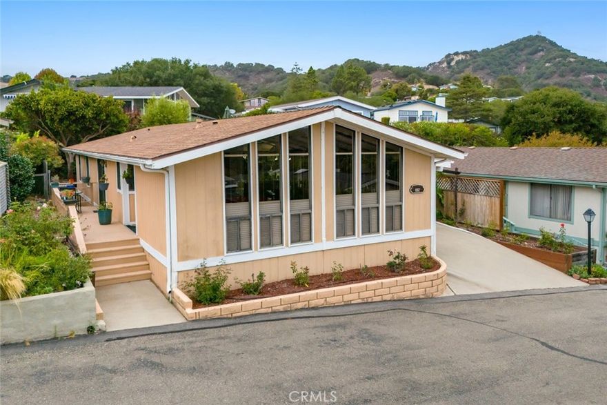A charming and relaxing home in the sought-after 55+ Indian Hill neighborhood of San Luis Bay Estates in Avila Beach. Nestled in the hills with panoramic views of the Santa Lucia Mountains and refreshing ocean breezes, this residence perfectly combines comfort, class and the relaxed coastal lifestyle. Inside, vaulted ceilings with exposed beams and walls of glass create a bright, airy atmosphere. The primary suite serves as a serene retreat, complemented by a second bedroom, an office or craft room, and laundry area. Outdoor living is at its best ideal for morning coffee, sunset dinners, or simply taking in the surrounding valley views. Indian Hill residents enjoy access to a private clubhouse, pool, spa, and a calendar of social activities. Beyond the gates, San Luis Bay Estates offers endless opportunities for recreation—minutes to the Avila Beach pier, Avila Golf Resort, Sycamore Mineral Springs, Bob Jones Trail, Edna Valley wineries. Perfectly Located between Pismo Beach and San Luis Obispo, it’s the perfect blend of tranquility and convenience, with shopping, dining, and entertainment just minutes away. This well-presented property is a rare opportunity to own in one of the Central Coast’s premier active-adult communities, where coastal beauty meets vibrant living.