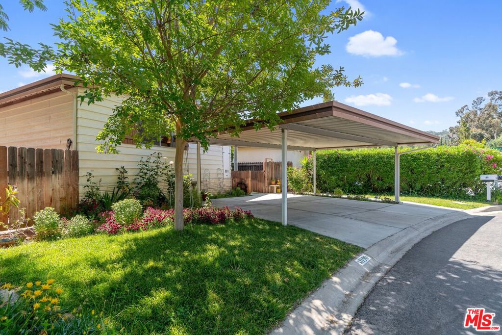 This charming retreat in the exclusive neighborhood of Calabasas Village offers peaceful community living just minutes from the area's best shopping, dining and schools. The ultra-private property features an expansive living/dining space with formal dining room, living room, and separate family room/office, plus two nicely-sized bedrooms and baths. Thoughtfully laid-out with an eye towards space-saving features, the home offers plentiful closet space and built-ins, plus a walk-in pantry and external storage sheds. Enjoy a fully fenced private yard and mountain views. The lovingly-maintained landscaping includes mature fruit trees, rosebushes, and florals that bloom year-round. Side-by-side covered parking is an added - and rare - bonus. Calabasas Village is just a short drive away from the world-famous Malibu beaches, and is surrounded by some of the country's best surfing, hiking, and biking. Enjoy exclusive access to community features such as the heated Olympic-size pool, spa, basketball/tennis courts, clubhouse, sauna, gym, dog park, and beautifully maintained grounds. The park covers water, trash, sewer, security, cable, and internet.