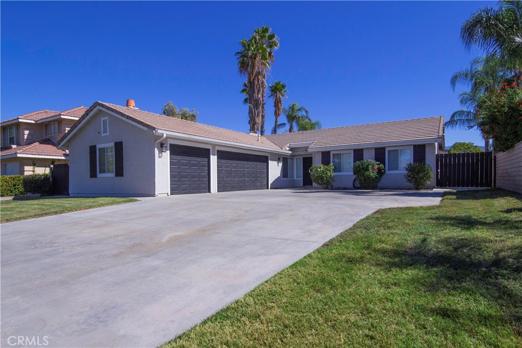 Welcome to this beautifully updated 4-bedroom, 2-bath ranch-style home located in a peaceful and picturesque Hemet neighborhood. With upgraded flooring throughout and high ceilings that create a bright and airy atmosphere, this home offers the perfect blend of comfort and style.
The updated kitchen features modern finishes and an open layout ideal for everyday living and entertaining. The spacious primary suite includes an en suite bathroom for added privacy and convenience. The oversized 700 sq. ft. three-car garage also offers ample space for vehicles, storage, or workshop use.  Theres even room for your travel trailer, toy hauler, and boat on the oversized driveway and side yard.  
Step outside to a large backyard—perfect for outdoor living, gardening, or creating your dream retreat. Located in an idyllic neighborhood with a welcoming atmosphere, this home delivers exceptional value and lifestyle and won't be for sale for long!