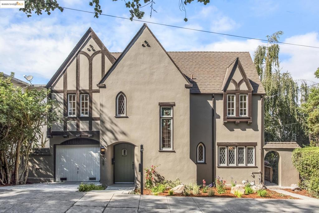 This 1928 Crocker Highlands Tudor has been beautifully renovated while preserving its historic charm. With 4 bedrooms and 2 baths upstairs—including a luxurious primary bath—it’s designed for modern living. The open main floor connects the living and dining rooms to a new spacious deck and stylish kitchen with breakfast nook, while the lower level offers a family room, office, half bath, and bonus space. Landscaped back & front yard, 1-car garage, and a location near award-winning elem school and Lakeshore shops make this home truly special.