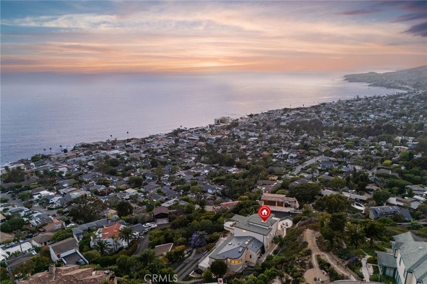 *** MODERN MASTERPIECE WITH UNRIVALED OCEAN VIEWS ***



Perched on a PRIVATE, STREET-TO-STREET LOT at the end of a QUIET CUL-DE-SAC, 900 GAINSBOROUGH DRIVE is a CONTEMPORARY ARCHITECTURAL TRIUMPH offering some of the most BREATHTAKING OCEAN AND CITY LIGHT VIEWS in all of LAGUNA BEACH. Encompassing approximately 4,100 SQUARE FEET across THREE LEVELS, this CUSTOM ESTATE spans TWO ADJACENT PARCELS—presenting a rare opportunity to add a POOL, SPA, OR GARDEN PAVILION overlooking the PACIFIC OCEAN.



Reimagined in a COMPREHENSIVE 2015 REMODEL, the residence blends SOPHISTICATION AND MODERN ELEGANCE, featuring SOARING CEILINGS, WALLS OF GLASS, a SPIRAL STAIRCASE, SMART HOME AUTOMATION, ELEVATOR ACCESS, and SEAMLESS INDOOR-OUTDOOR LIVING that captures PANORAMIC COASTAL VISTAS from nearly every room.



The MAIN LEVEL is anchored by a SHOWSTOPPING OCEAN-VIEW GREAT ROOM, opening to an EXPANSIVE TERRACE adorned with VINTAGE TILE—an ENTERTAINER’S DREAM. The CHEF’S KITCHEN boasts SLEEK MIELE APPLIANCES, CUSTOM CABINETRY, a LARGE ISLAND WITH SEATING, and a WALK-IN PANTRY. Two EN-SUITE BEDROOMS, a FULL GUEST BATH, and a SPACIOUS LAUNDRY ROOM complete this level.



The ENTIRE UPPER FLOOR is dedicated to the OWNER’S RETREAT, a private sanctuary with SWEEPING OCEAN AND CATALINA ISLAND VIEWS. This LUXURY SUITE features a SPA-INSPIRED BATH with DUAL WALK-IN SHOWERS, a FREESTANDING TUB WITH FIREPLACE, PRIVATE SITTING AREA, and a VIEW BALCONY perfect for SUNSET UNWINDING.



The LOWER LEVEL offers REMARKABLE FLEXIBILITY, with a SEPARATE LIVING AREA, FIREPLACE, KITCHENETTE, and PRIVATE PATIO—ideal for a GUEST SUITE, HOME OFFICE, GYM, STUDIO, or MEDIA ROOM.



Outside, MULTIPLE TERRACES AND GARDENS embrace the essence of SOUTHERN CALIFORNIA LIVING. Two SEPARATE 2-CAR GARAGES and EXTENSIVE STORAGE enhance functionality, while its construction on SOLID BEDROCK ensures EXCEPTIONAL STRUCTURAL STABILITY.



Just minutes from WORLD-CLASS BEACHES, SCENIC HIKING TRAILS, UPSCALE DINING, and the CULTURAL CHARM OF LAGUNA VILLAGE, 900 GAINSBOROUGH DRIVE is more than a home—IT’S A LEGACY ESTATE THAT DEFINES COASTAL LUXURY LIVING.