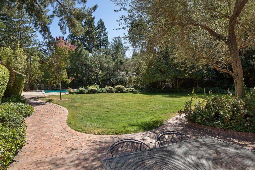 This 4-bedroom home is located in a prime location at the end of the cul-de-sac off Polhemus. The lot size is 43,955 sq.ft lot (1.009 acres) per the subdivision map dated July, 1957 Buyer to confirm. This incredible lot has had many recent changes to the backyard. There is an expansive grass area and swimming pool. Please review at this new price. One could either remodel the home and/or build their dream home. It is in the Las Lomitas Schools District.