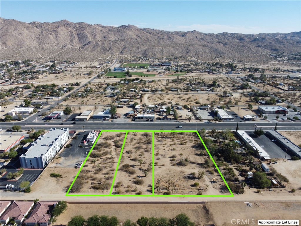 3.65 acres of Commercial Property in the Town of Yucca Valley! Prime location with Highway 62 frontage. This property offers incredible potential for a range of uses including retail, restaurants, offices, and more! The property had a preliminary approval for the development of a senior multi-family residential development in 2021. A topographic site survey can be provided. The sale includes 3 parcels totaling 3.65 acres, APN 0587-351-03, APN 0587-351-04, and APN 0587-351-05. All utilities available. Down the street from a California Welcome Center and a short drive to well known Joshua Tree National Park which draws over 3 million visitors a year. Buyer to do their own due diligence and check on permits, utilities, and zoning. Don't miss out, take a look at this property today!