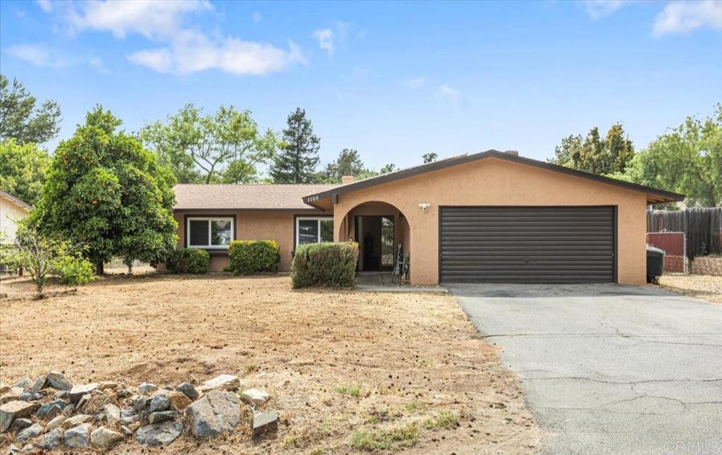 Assumable VA Loan at Just 2.25%! One of the lowest rates offered in ALL San Diego County by FAR! Huge lot with Detached Workshop! RV Parking, Single Level! Children can walk to school! Welcome to your next home, a spacious and charming 4-bedroom, 3-bathroom singe family home nestled on a generous 0.34-acre lot in beautiful Fallbrook. With 2,000 sq. ft. of living space and two living rooms, there's plenty of room for relaxation, entertaining, and making lasting memories. Steps from nearby schools! A standout bonus is the detached workshop/garage, offering excellent space for hobbies, projects, or extra storage. This warm and character-filled home features a blend of hardwood and tile flooring, exposed wooden beams, and a cozy layout ideal for growing families. Step into the backyard and discover your personal retreat: a covered patio for shaded gatherings, a custom wooden bar for weekend entertaining, a fire pit for evening hangouts, and a kids’ play set that’s perfect for little adventurers. There’s even space for a garden! Originally built in 1973, the home is move-in ready and full of potential. While it could benefit from a few updates, it's the perfect canvas for your personal touch. If you're looking for charm, space, and value, this is it. This one won’t last long!