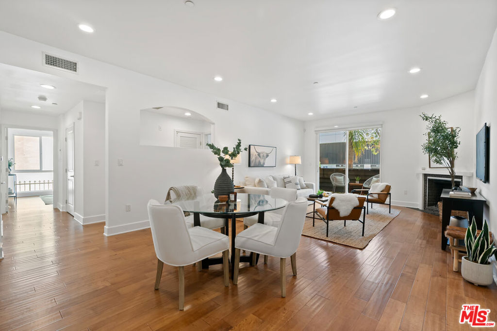 Beautiful, move-in ready Brentwood adjacent condominium! This light and bright, 2nd floor dual en-suite home, conveniently located off of Wilshire Blvd. in West LA, affords an open floor plan with hardwood floors, fireplace, private balcony, in-unit washer/dryer and high ceilings with recessed lighting throughout. The newly remodeled, open kitchen offers quartz countertops, modern cabinetry and stainless steel appliances. The three bedrooms include two generously sized en-suites with abundant closet space and gratifyingly modern bathrooms. The building also offers ample guest parking along with amazing ocean and city views from its rooftop deck!