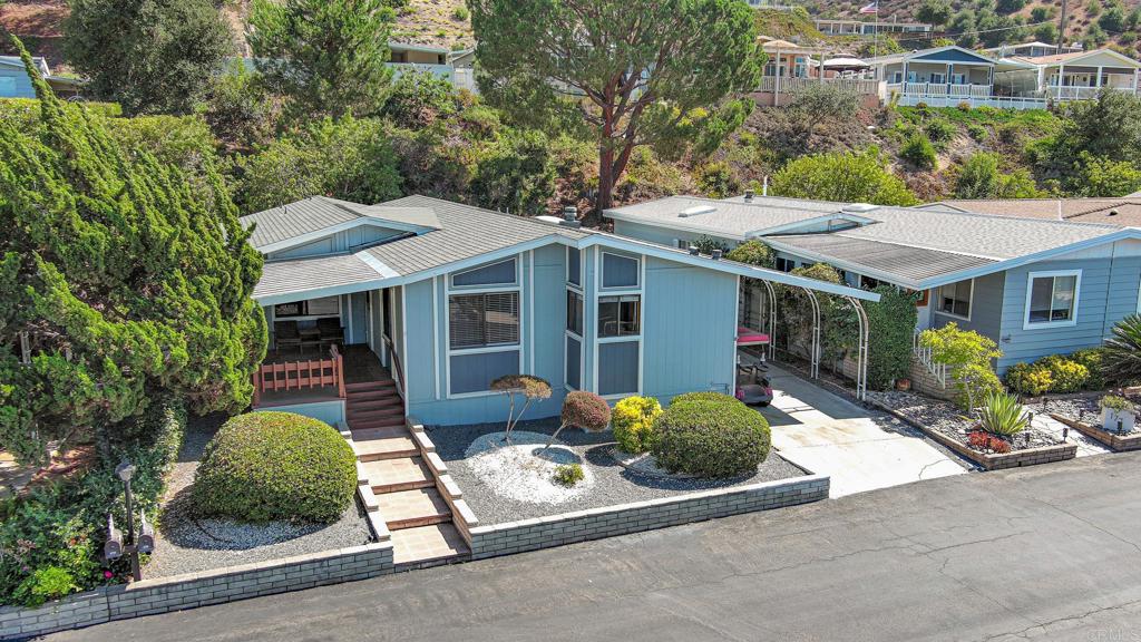 Rancho Monsreate Country Club...enjoy the country club life-style from your amazing turn key home. Open, light and bright spacious floor plan with two large bedrooms and an office or third bedroom. Oversized lot with fruit trees, flowers, garden, and a patio area in a private, fenced back yard. There is a huge wooden shed with electricity and lots of storage. Free golf, tennis, pickle ball, RV storage, walking trails...too many amenities and activities to list in this active 55 plus park!