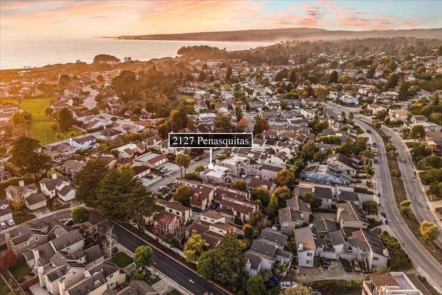 Just moments from the stunning shores of Monterey Bay. Step inside this very special home to discover impressive vaulted ceilings that create a grand sense of openness as you enter the living room, highlighted by a wood-clad fireplace, plantation shutters, and high-end finishes throughout. The middle level offers a comfortable guest bedroom, full bathroom, and a dining area that flows seamlessly into the well-designed kitchen, perfect for everyday living or entertaining. From here,step out to a private backyard oasis featuring a spacious deck, charming sitting areas, lush landscaping, and a soothing hot tub-a peaceful setting for relaxing or gathering with friends. Upstairs, a versatile landing area provides the ideal space for a home office, fitness area, or guest retreat. The expansive primary suite feels like a true sanctuary, offering a huge walk-in closet, a spa-like bathroom, and access to a private rooftop deck that evokes the charm of European architecture. Enjoy the best of Seascape living, where miles of coastline, scenic trails, and world-class surfing are just a short stroll away. Nearby, the Seascape Sports Club and local golf courses offer endless opportunities for recreation and relaxation. 2127 Penasquitas Drive-where refined design meets relaxed coastal living.