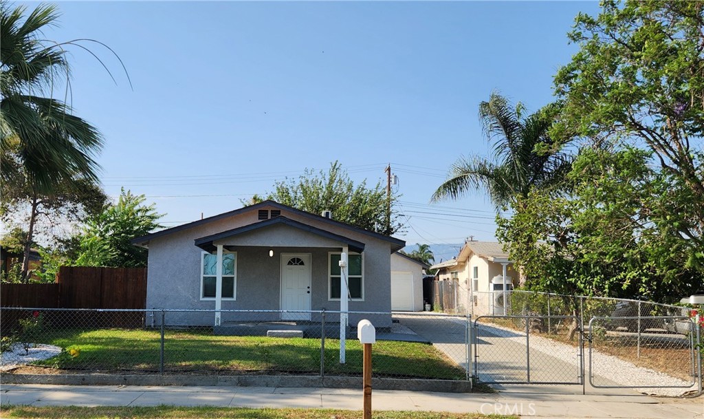 Beautiful Turnkey 2 Bedroom 1 Bath House with Detached 2 Car Garage in Colton. Exterior and Interior Have Been Completely Remodeled. Exterior Features New Landscaping, New Roof, New Electrical Panel, New Water Heater, New Windows, New Paint, New Garage Door, New Back Yard Wood Fence, and Fenced Front Yard. Interior features New Electrical, New Plumbing, New Paint, New Baseboards, New Panel Doors, New Light Fixtures, Ceiling Fans in Bedrooms, and SPC Wood Look Laminate Flooring Throughout. There are 2 Bedrooms with Good Closet Space. Bathroom has been Remodeled with New Tiled Shower / Tub, Toilet, Sink, Fixtures, and Vanity with Quartz Counter Top. Living Room Features Plenty of Space for All your Furniture. Kitchen is Remodeled with New White Shaker Cabinets, New Quartz Counter Tops, New Stainless Sink, New Freestanding Stove / Oven, New Range Hood, and New Fixtures. House features Split System Ductless Heat and A/C. Backyard is a Good Size. Perfect for all your entertainment needs. Property is commuter friendly close to the 10 and 215 Freeways. Shopping and some Dining Nearby. Call Today to Take a Look At this Great Property!